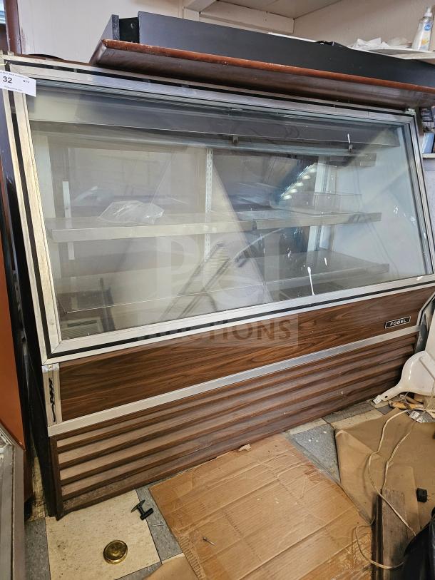 Fogel refrigerated deli display case, showing several signs of wear and non-functional condition, with a visible Fogel label.