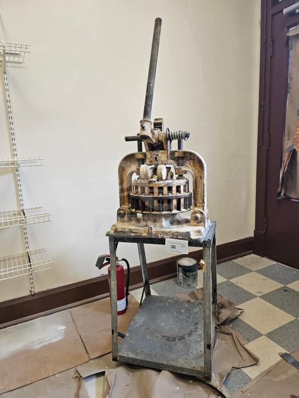 Dutchess Tool Company dough divider, vintage, metal with lever, moderate wear, item tag "36" attached to base.