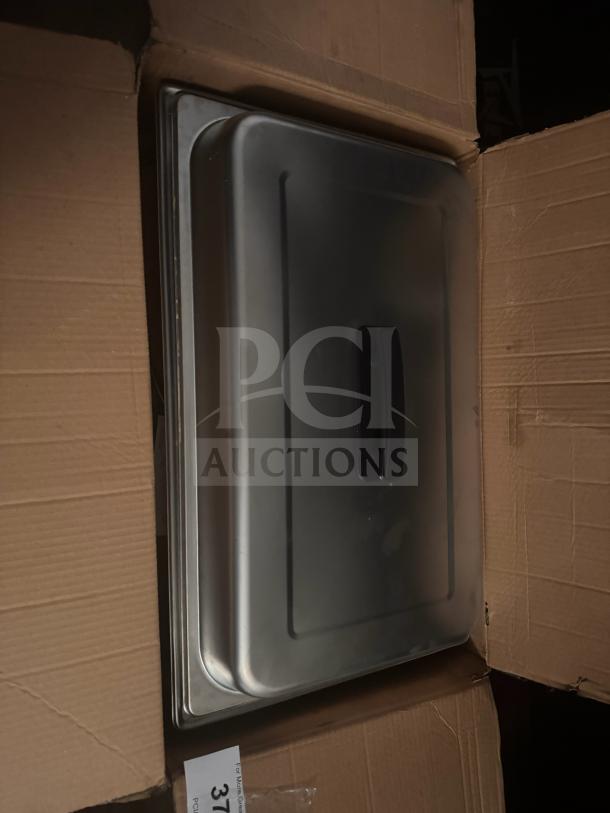 Full-size stainless steel chafer in shipping box, features a sturdy lid and durable design, ideal for catering use.