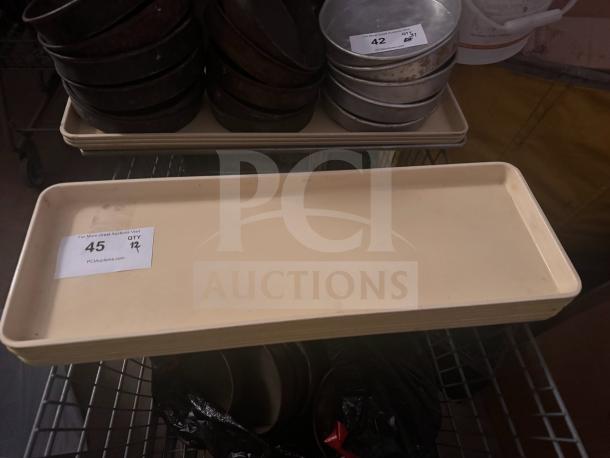 Cream-colored plastic tray, rectangular, good condition. Auction label reads "45" and "QTY 17".