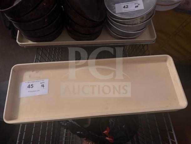 Cream-colored rectangular plastic tray with slight wear, auction label showing item 45, 12 quantity indicated.