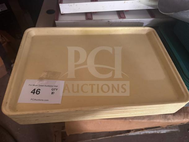 Lot of 10 beige plastic trays, lightly used, rectangular with raised edges. Auction tag shows lot number 46, quantity 10.