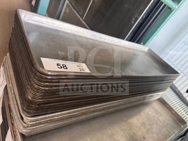 Stack of 1/2 size long bakery display trays, quantity 20, used condition, metallic finish, auction label marked "58."
