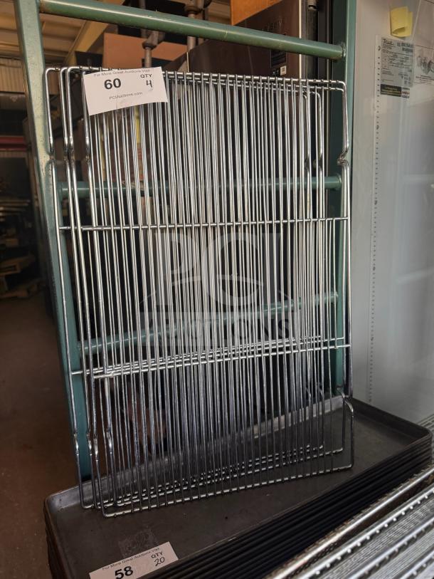 Metal cooling rack with multiple bars, in excellent condition, auction tag marked "60 QTY 4" visible.