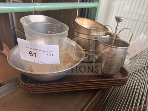 Various kitchenware including measuring cups and sifters, some showing wear. Tag marked "61 QTY".