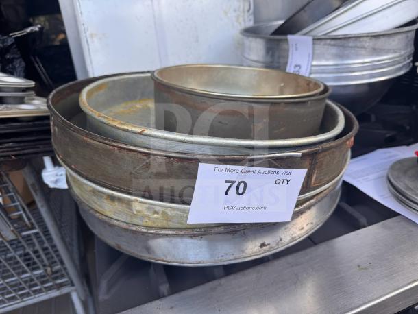 Lot of 5 assorted baking pans, varying sizes, metal, used condition with some rust. Auction tag shows quantity as 70.
