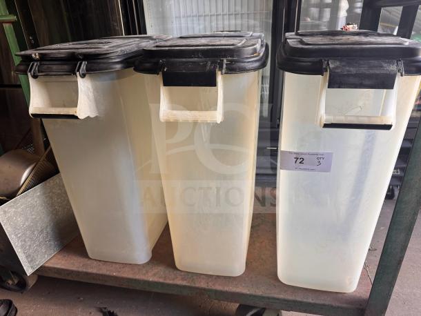 Three large plastic storage food containers with black lids, showing slight wear. Label reads "72, QTY 3, PCI Auctions."