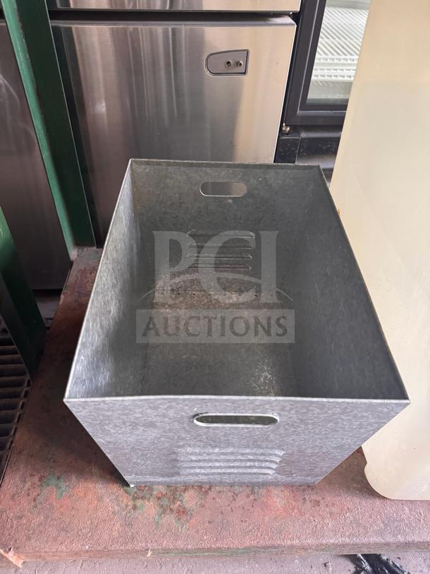 Steel galvanized utility bin with handles, rectangular shape, vented sides, and used condition. Ideal for storage use.