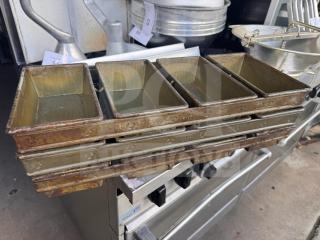 Lot of 3 industrial baking pans, stacked, showing welded joints, used condition with visible wear.