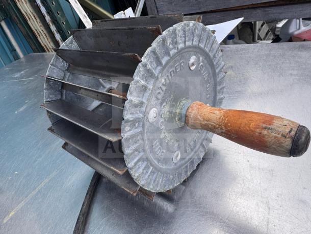 Vintage Miller Bun Divider with wooden handle, metal blades, and stamped markings. Good condition, ideal for collectors.