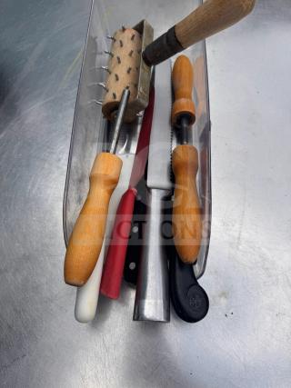 Assorted kitchenware with wooden handles and metal parts, including knives and a spiked rolling tool, in good condition.