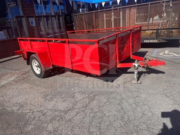 Red utility trailer in used condition, no title available, sturdy metal frame, single axle, bright red finish.