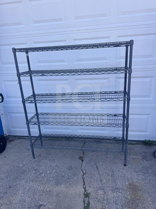 5-tier steel wire shelving unit in good condition, suitable for storage, featuring adjustable shelves and durable metal construction.