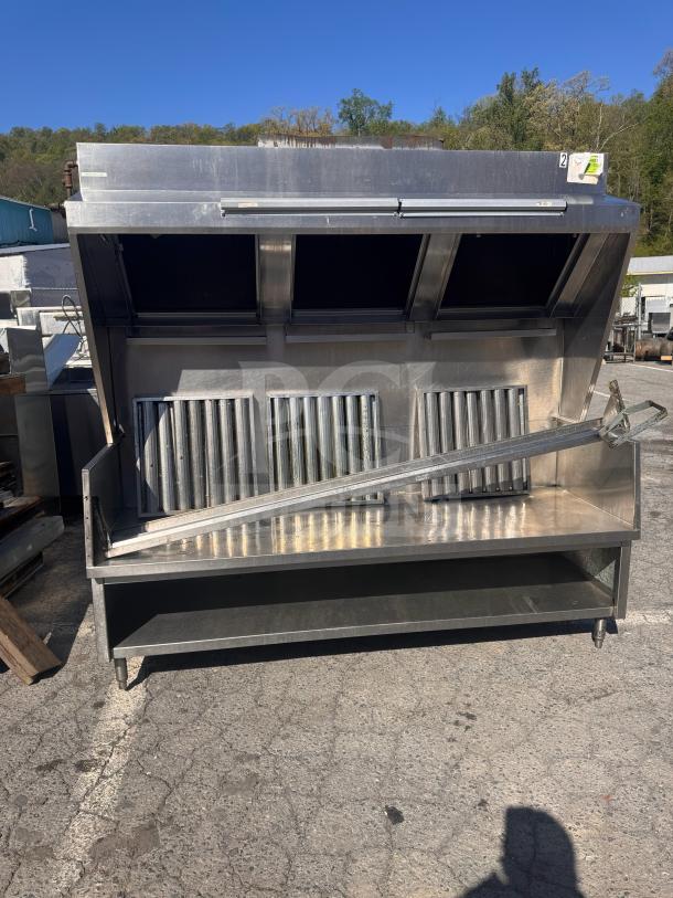 6 1/2 foot low profile commercial exhaust hood, stainless steel, suited for food trucks, includes grease filters, used condition.
