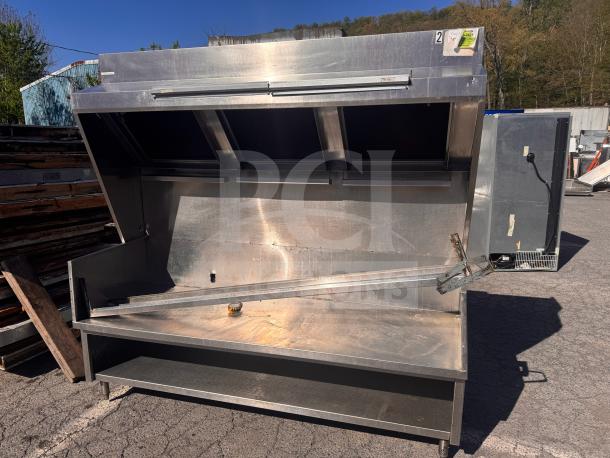Low profile 6 1/2 ft commercial exhaust hood, ideal for food trucks, stainless steel, used condition, outdoor setting.