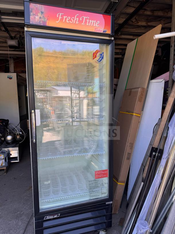 Turbo-Air TGM-22CR single door cooler merchandiser in working condition, featuring glass door, interior shelving, and "Fresh Time" branding.