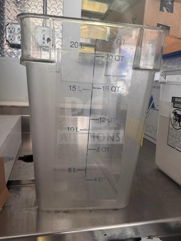 Clear 22qt storage food container with measurement markings up to 20L/22QT, good condition, ideal for kitchen storage.