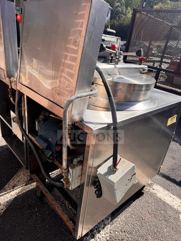 BKI FKM-FC commercial electric pressure fryer in used condition, 208 volts, visible wear on exterior, with attached wiring and controls.