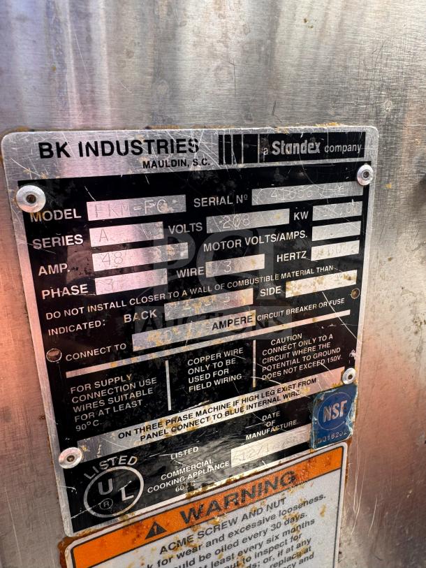 Metal label on BKI FKM-FC electric pressure fryer, 208V, detailing model, series A, and electrical specifications. NSF certified.