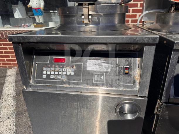 BKI FKM-FC commercial electric pressure fryer, 208V, stainless steel, used, with control panel buttons and BKI Industries label.