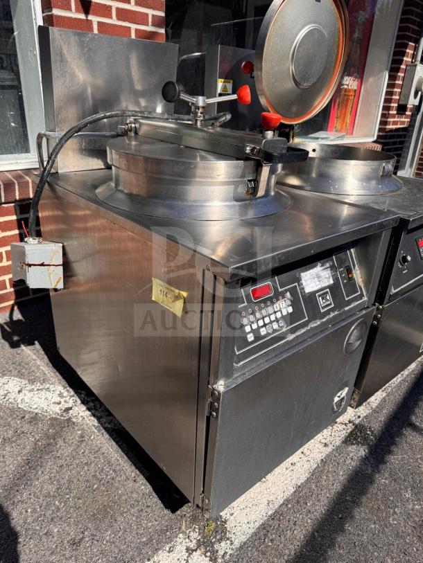 BKI FKM-FC commercial electric pressure fryer, 208 volts, stainless steel, digital controls, good condition, model markings visible.
