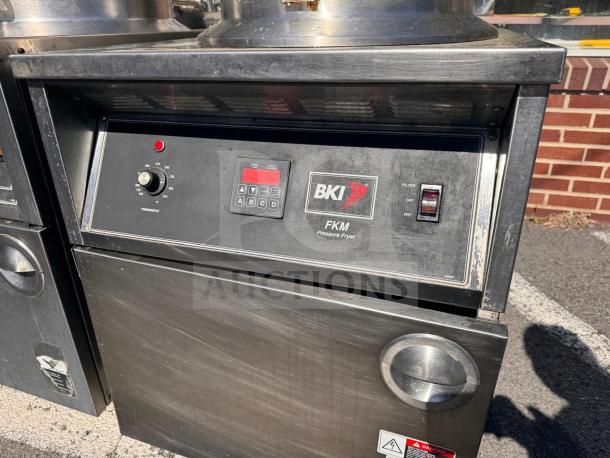 BKI FKM-FC commercial electric pressure fryer, 208 volts, stainless steel, digital controls, visible wear, industrial setting.