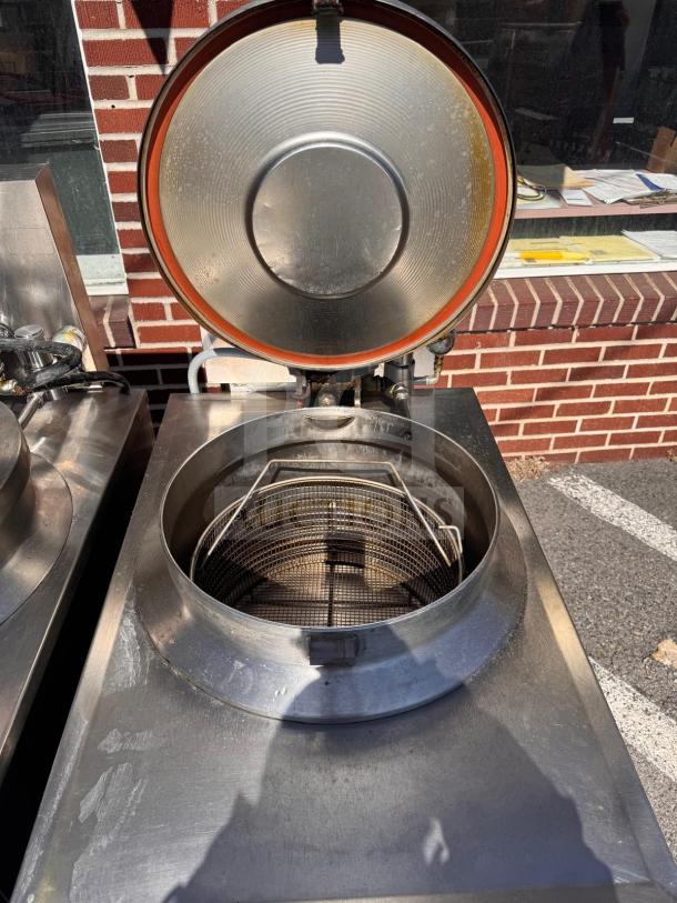 BKI FKM-FC commercial electric pressure fryer, 208 volts, stainless steel, used condition, open lid and mesh basket visible.
