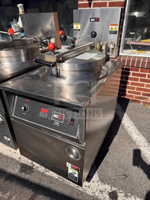 BKI FKM-FC electric pressure fryer, stainless steel, 208V. Control panel and safety warnings visible. Good condition.