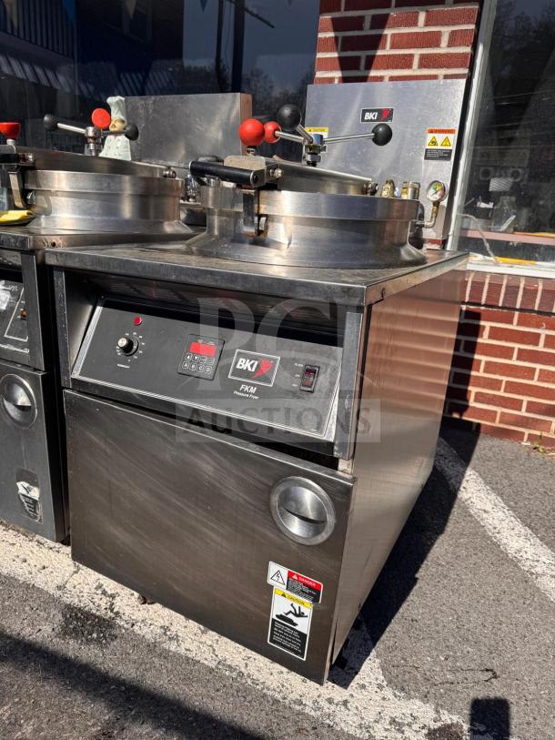 BKI FKM-FC commercial electric pressure fryer, stainless steel, 208 volts, includes control panel and safety warnings.