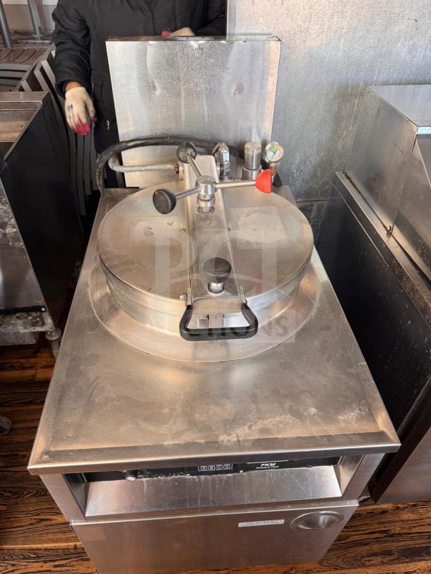 BKI FKM-F commercial electric pressure fryer, stainless steel, 208 volts, used condition with visible dials and control panel.