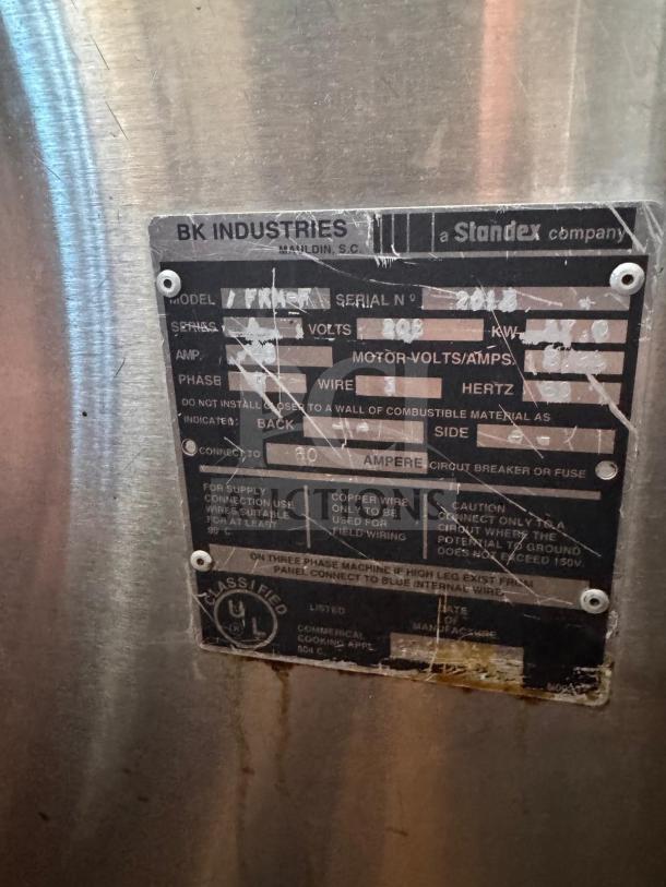 BKI FKM-F commercial electric pressure fryer, 208 volts, metal finish, visible manufacturer plate with specs and serial number.