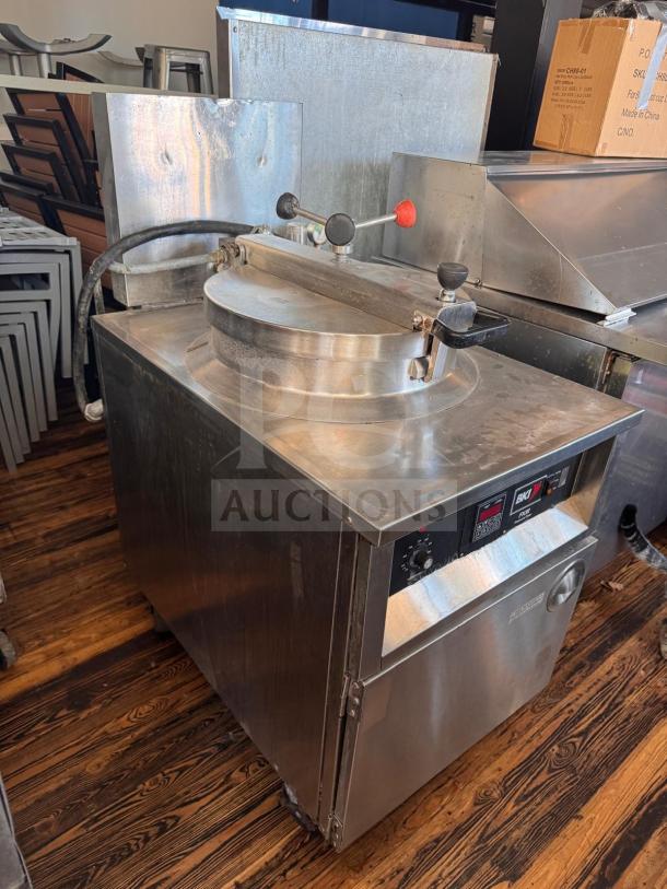 BKI FKM-F electric pressure fryer, 208 volts, commercial-grade, stainless steel, visible control panel, used condition.