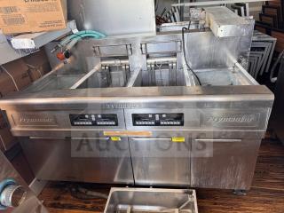 Frymaster FMRE222CSC double electric fryer with two dump stations, stainless steel, visible control panels, used condition.