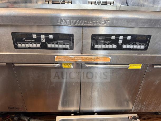 Frymaster FMRE222CSC double electric fryer with two dump stations, control panel, and visible labels, in good condition.