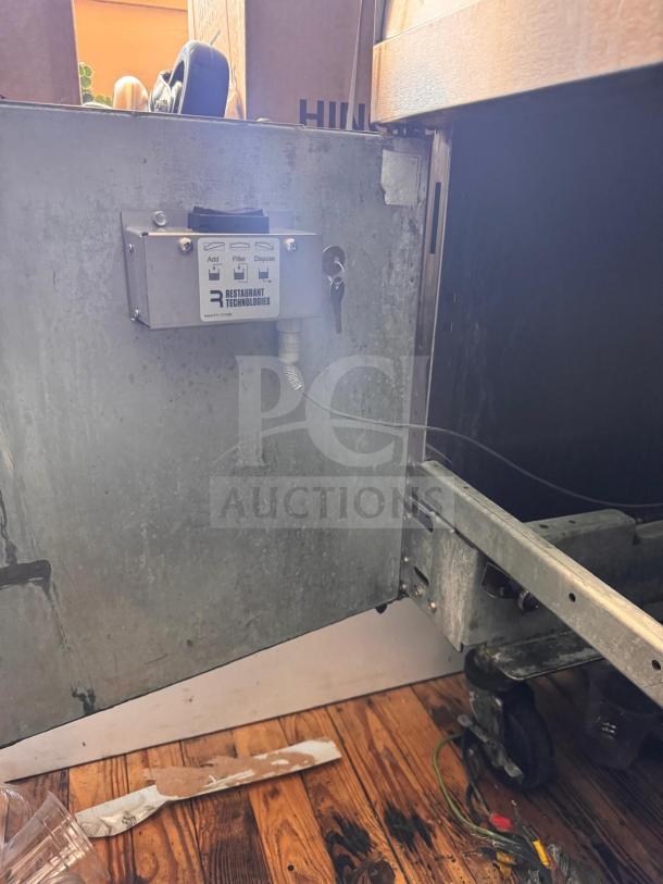 Frymaster FMRE222CSC Double Electric Fryer with two dump stations, showing controls. Good condition, features visible wiring.