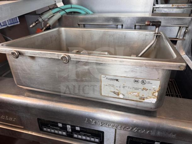 Frymaster FMRE222CSC double electric fryer with 2 dump stations, stainless steel, visible wear, label shows model and serial number.