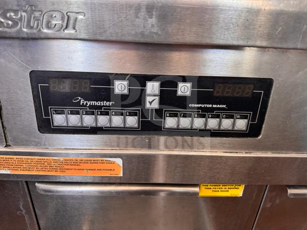 Frymaster FMRE222CSC double electric fryer with control panel, "Computer Magic." Includes two dump stations. Visible warning labels.