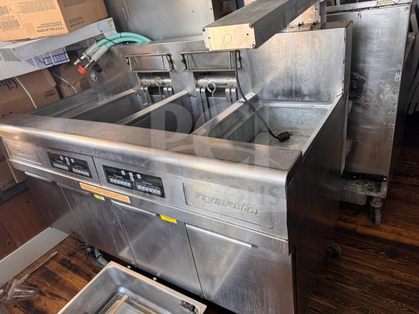 Frymaster FMRE222CSC double electric fryer with two dump stations, stainless steel, integrated controls, pre-owned condition.