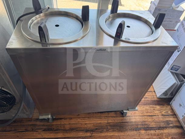 Delfield CAB2-1200ET mobile dish dispenser, stainless steel, two stack, visible Delfield label, on casters for mobility.