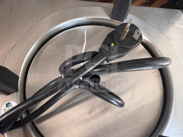 Delfield CAB2-1200ET mobile dish dispenser, stainless steel, top view with power cord, minor wear visible.