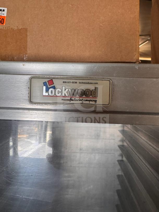 Lockwood sheet pan cabinet in metal, featuring manufacturer's label. Sturdy construction, suitable for commercial use.