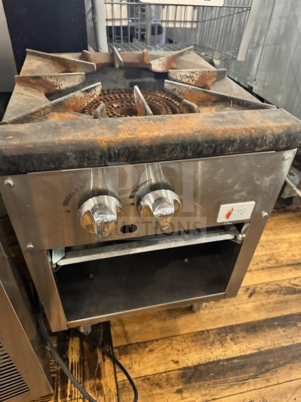 CPG natural gas stock pot range, dual knobs, worn condition, visible rust, stainless steel body, suitable for large-scale cooking.