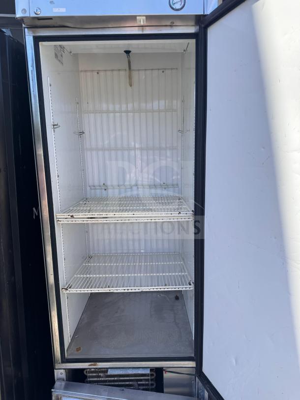 True T23-F Solid Door Freezer, open view, tested and working, two wire shelves, visible interior, used condition.