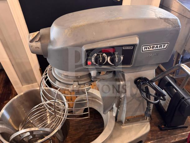 Hobart HL200 Legacy 20-Quart Mixer, crack on right side, tested and working. Features control panel and stainless steel bowl.