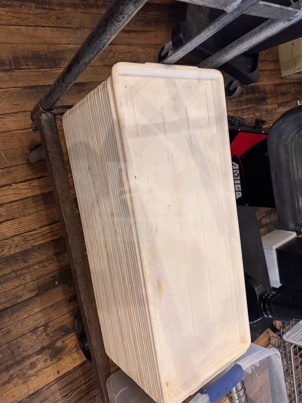 Long white plastic tray, used condition, with ribbed sides and slight discoloration. Suitable for storage or serving.