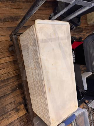 Long white plastic tray, used condition, with ribbed sides and slight discoloration. Suitable for storage or serving.
