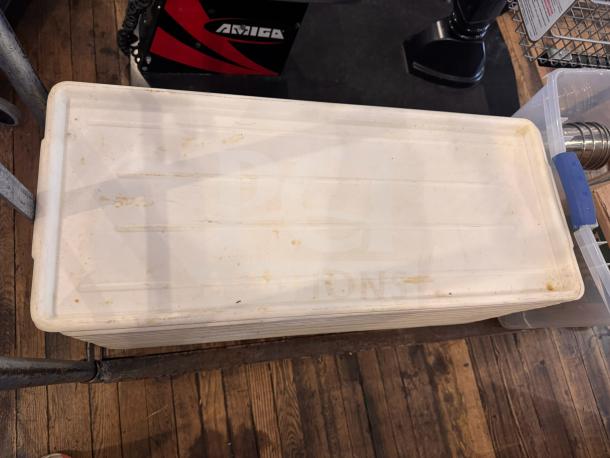 Long white plastic tray with rectangular shape, noticeable surface wear and discoloration, suitable for storage use.