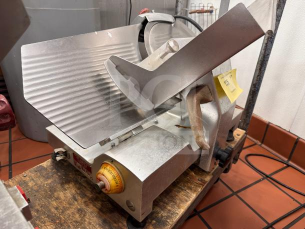Fleetwood 412 Slicer, metal, tested and working, adjustable blade thickness, used condition, visible control knob and handle.