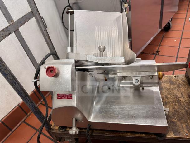 Fleetwood 412 Slicer, metal finish, tested and working, visible caution label, used condition, with power cord.