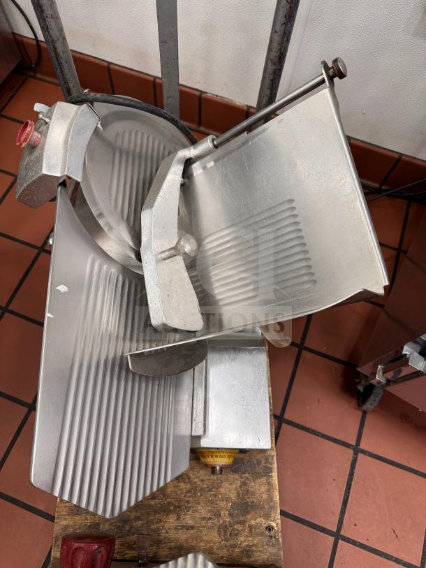 Fleetwood 412 Slicer, tested and working, metal finish with adjustable blade, visible power cord, in good condition.